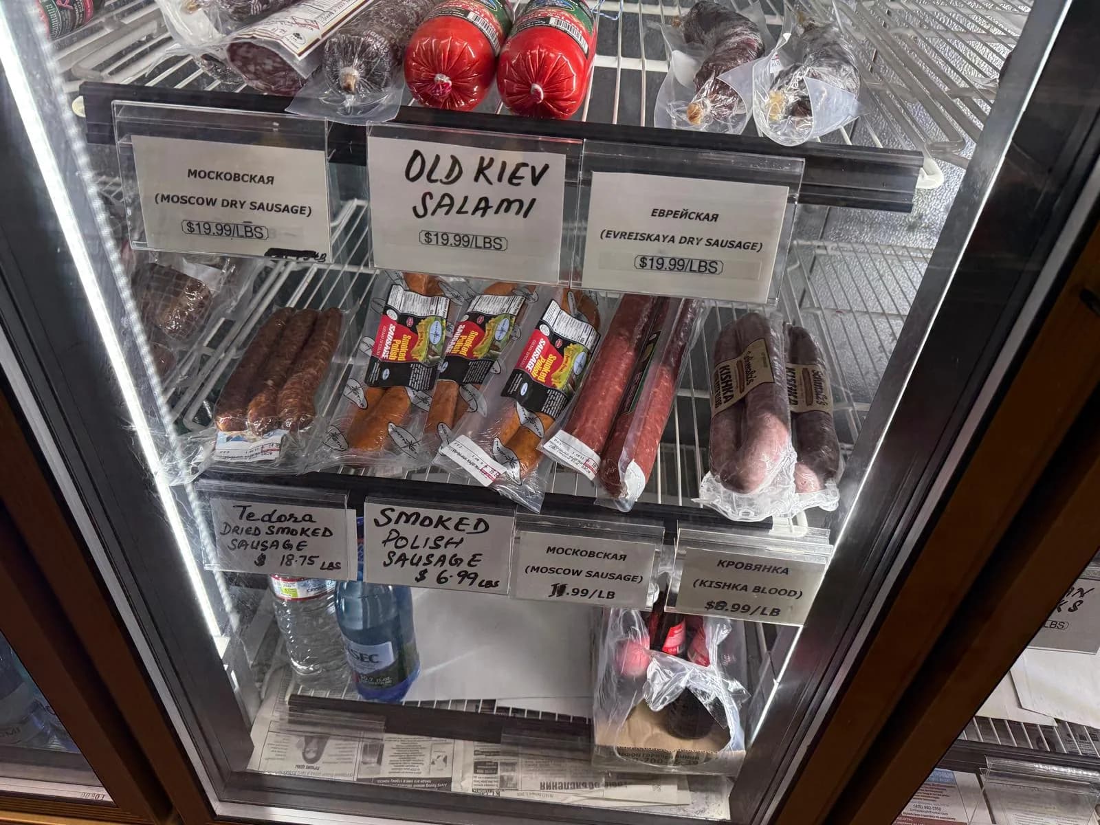 The deli case with Old Kiev salami and smoked European sausages