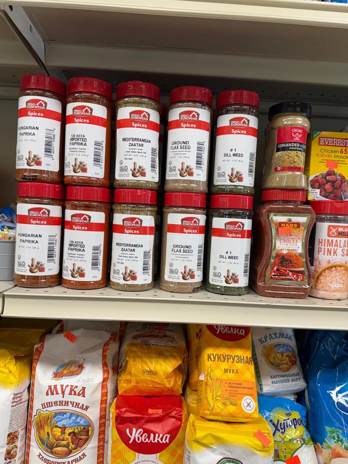 Jars of spices and baking staples on the pantry shelf
